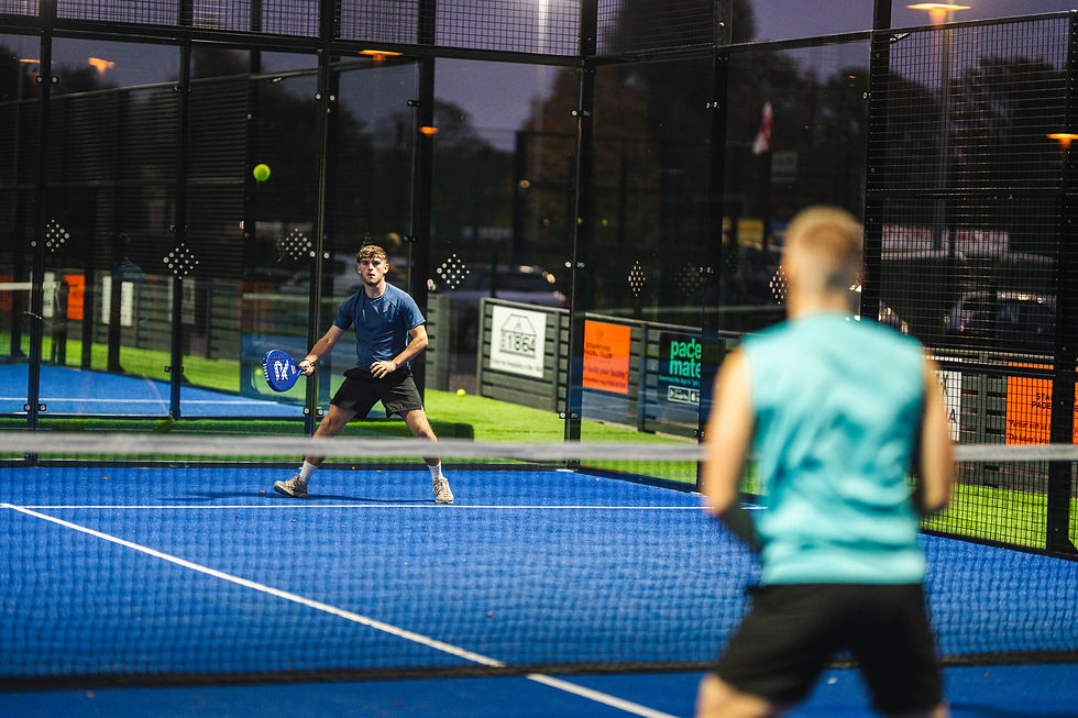 two young men playing padel at stafford padel club