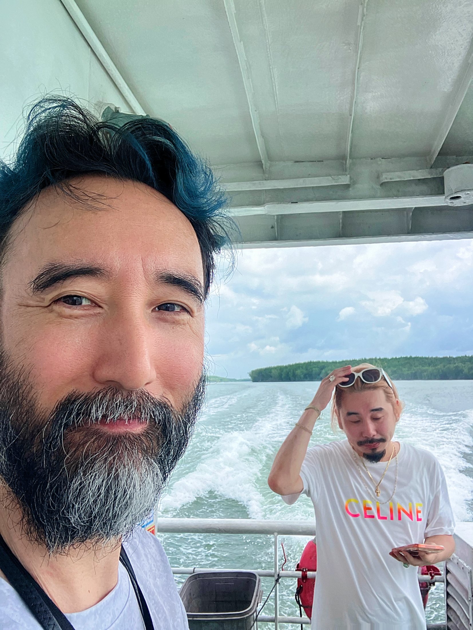 Original travel photograph: two people aboard a boat on the water