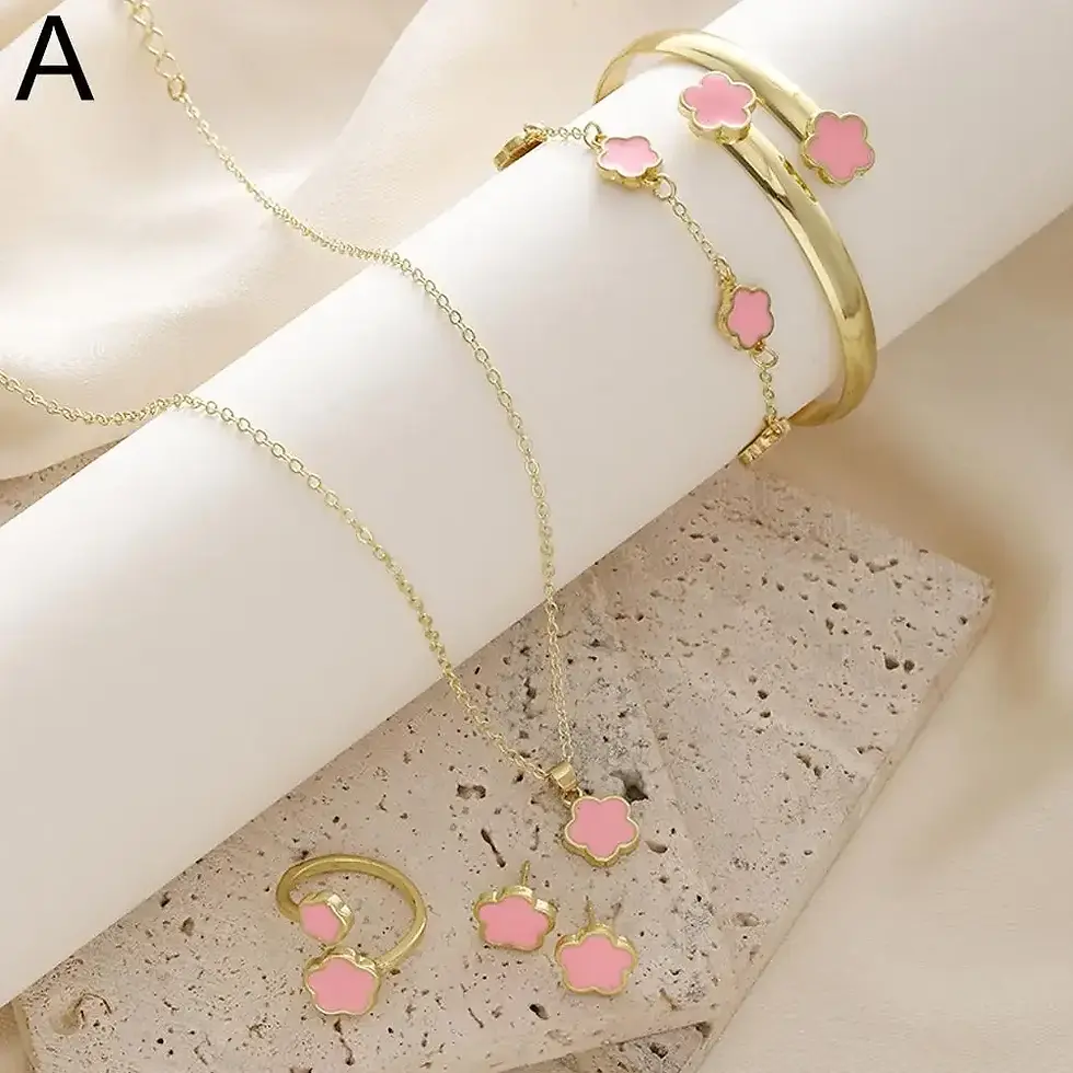 Thumbnail: Gold jewelry set with pink flower accents.