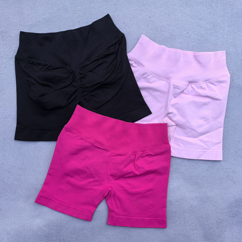 Thumbnail: Three pairs of women's shorts in black, pink, and lavender colors