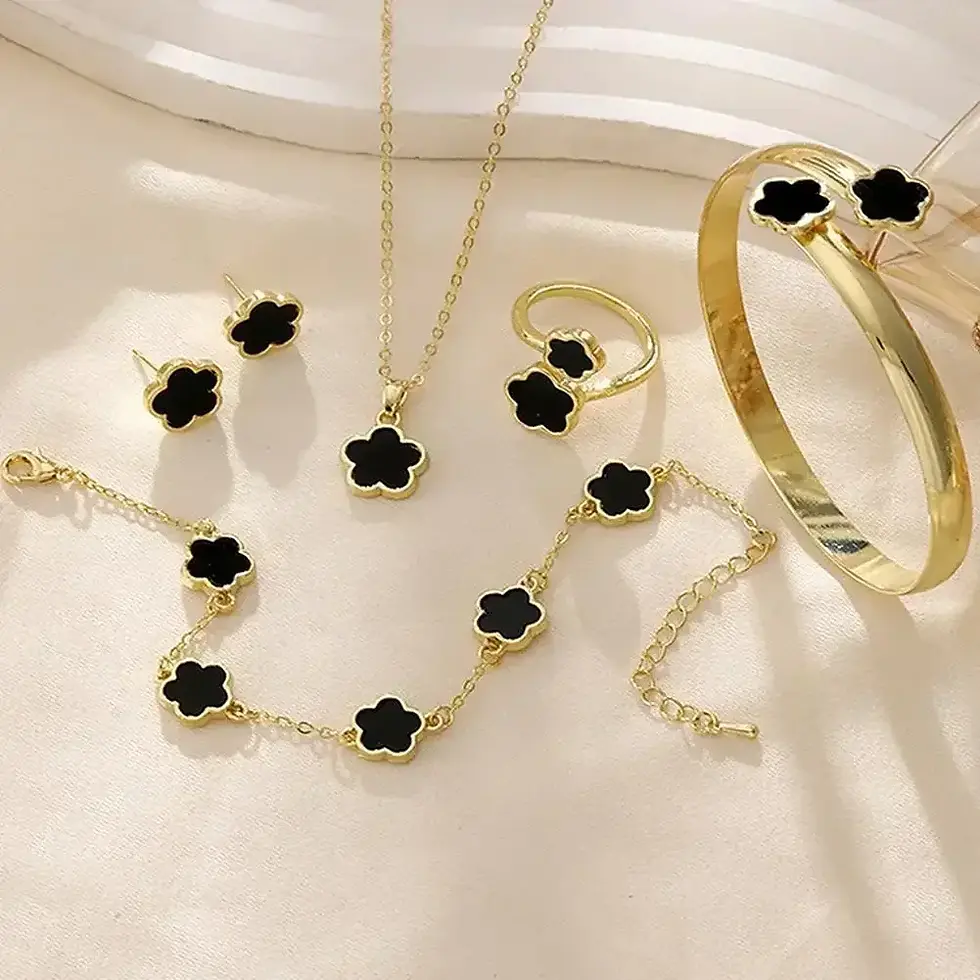Thumbnail: Gold jewelry set with black flower accents