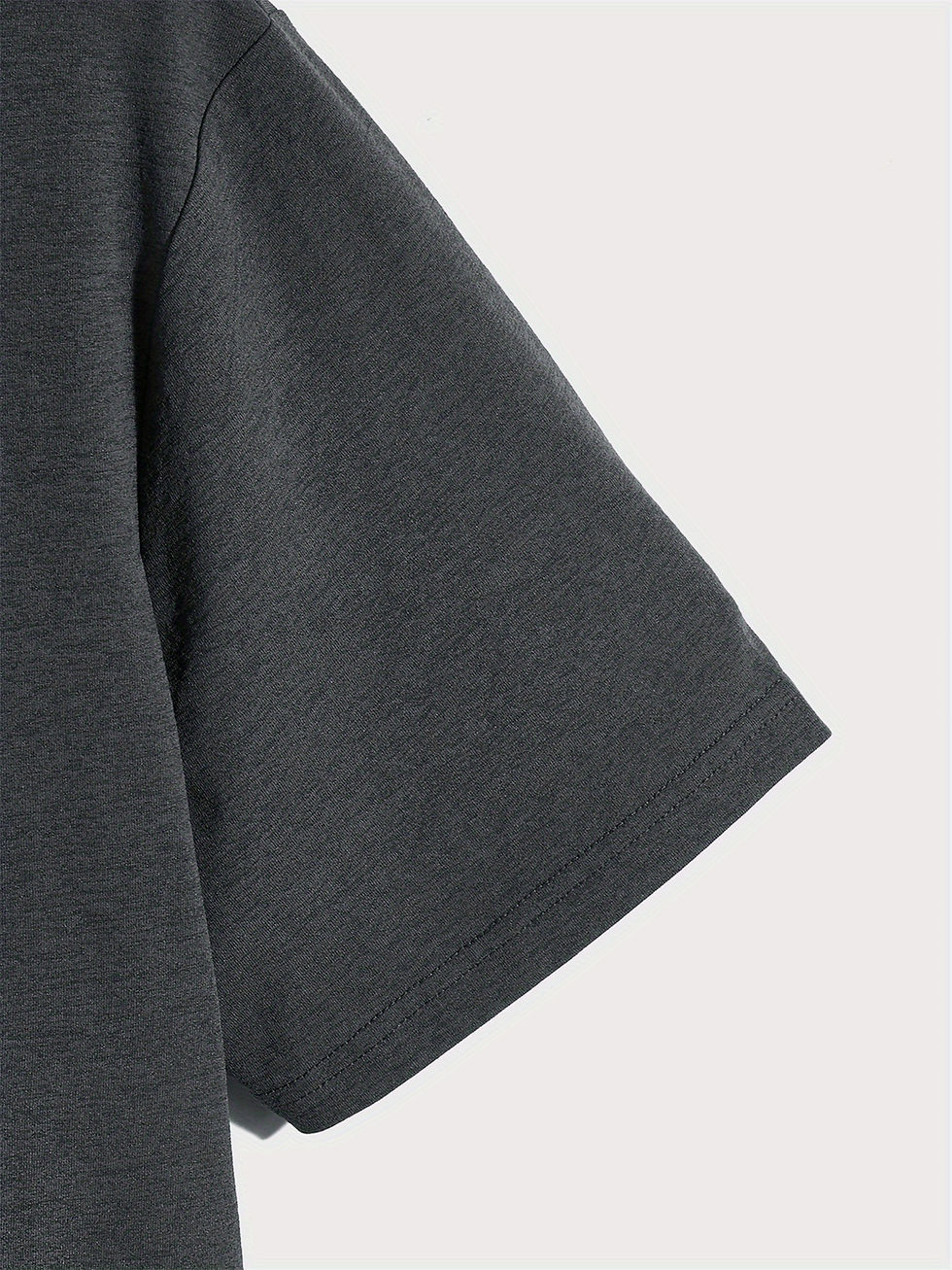 Thumbnail: Close-up of gray t-shirt sleeve