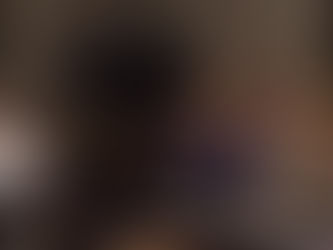 Three people in a wood-paneled room, one playing a keyboard. Relaxed mood. A screen reads "Hair and Hustle."