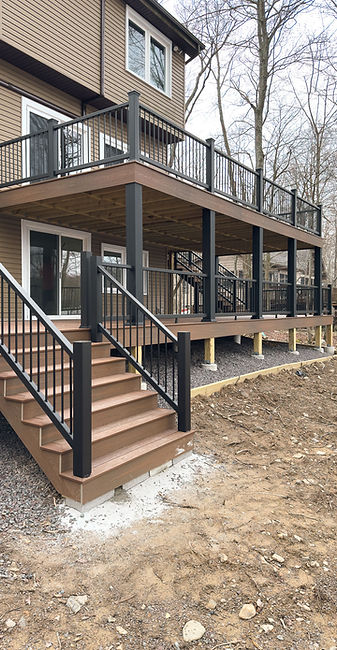 2 tier residential composite deck with black handrails and balusters
