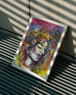 minimalist-frame-mockup-positioned-on-metal-grid-surface-with-sunlight-stripe-shadows-0587