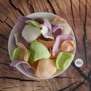 Overhead view of colourful vegan Thai crackers in a serving bowl