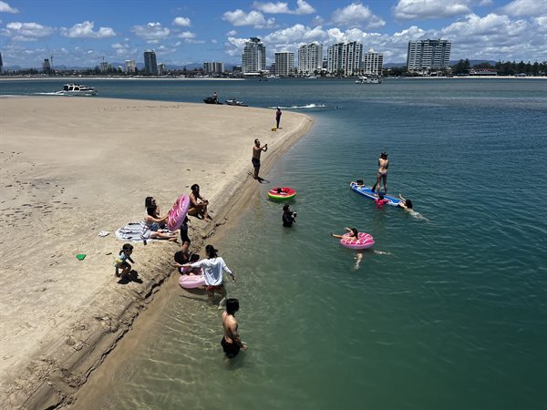 Aerial view of guests swimming at Wave Break Island with Island Party Cruiser private boat hire Gold Coast