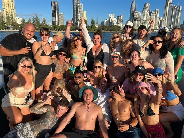 Large corporate group on Island Party Cruiser with Q1 skyline
