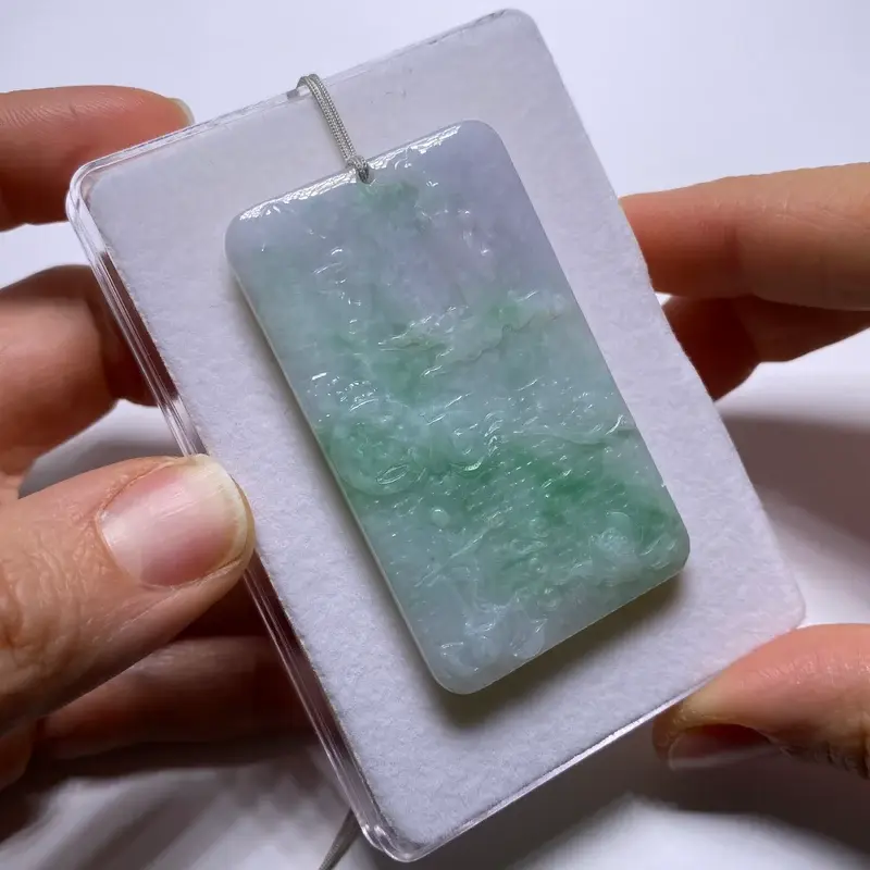 Thumbnail: Natural jadeite plaque from Kachin State, Myanmar, angled front view on white felt