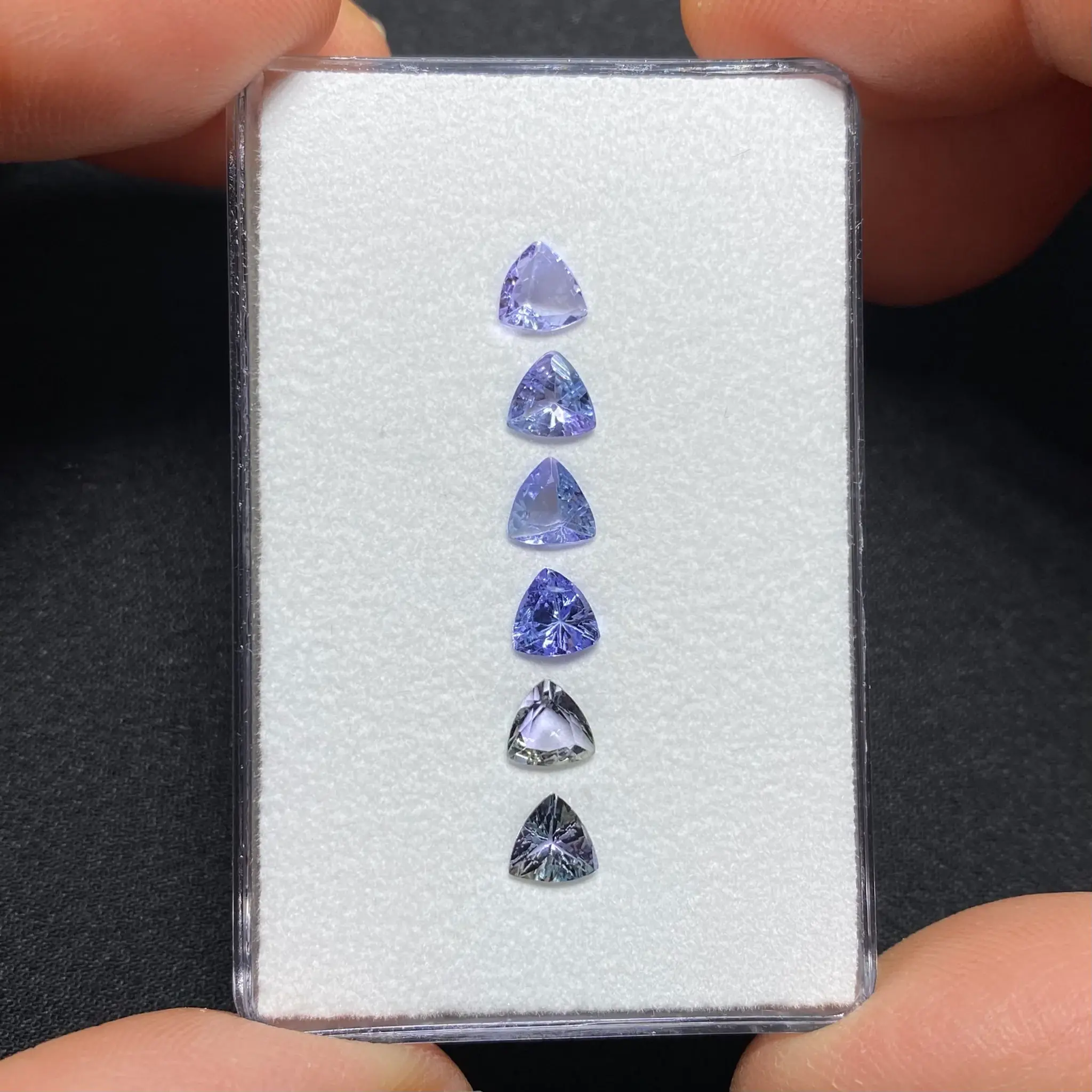 Six natural tanzanites from Merelani Hills, Tanzania, totaling 2.30 ct in trillion cuts.