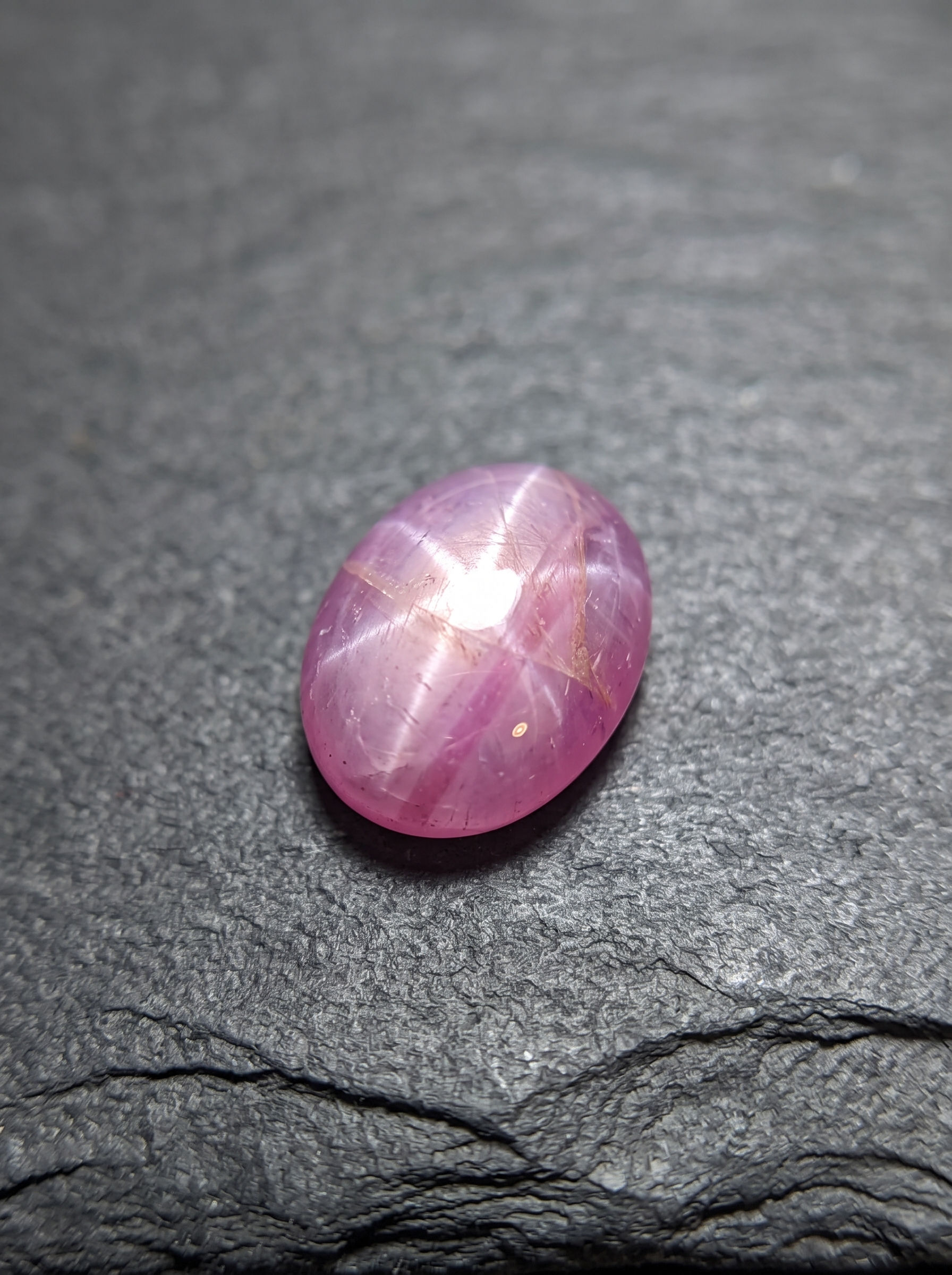 View of the Vietnamese star sapphire showing its six-ray asterism under illumination.
