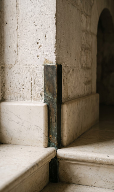 Historic Italian architectural detail in aged marble and patinated bronze, reflecting the heritage and design lineage of Dant
