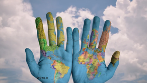 hands with the globe painted on them