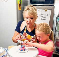 Aunt B Decorating a cake with her niece.