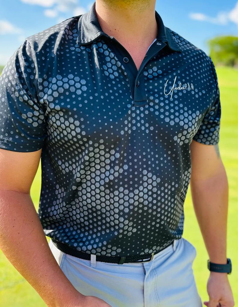 Thumbnail: UnderPAR Golf Shirt Honeycomb Black and Grey man walking on golf course facing side