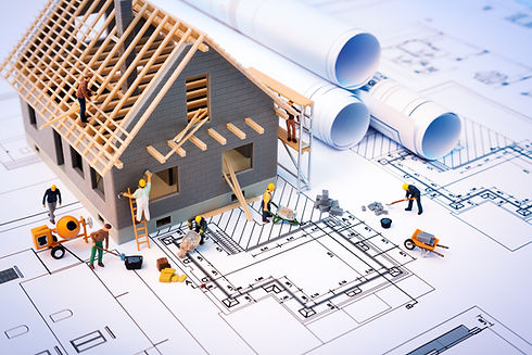 building house on blueprints with worker - construction project_.jpg