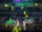 Corporate event reception at racetrack with bleachers, lighting, DJ, food trucks, and tents