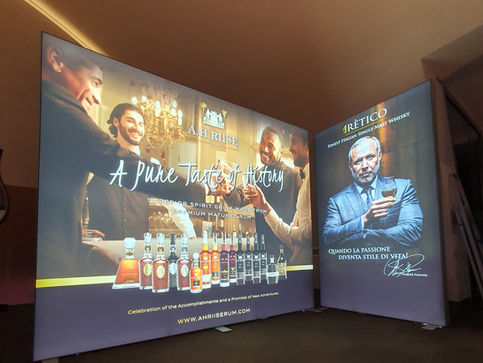 Progettazione, stampa e allestimento di pareti luminose GraficBox Distilleria Psenner - Alto Adige