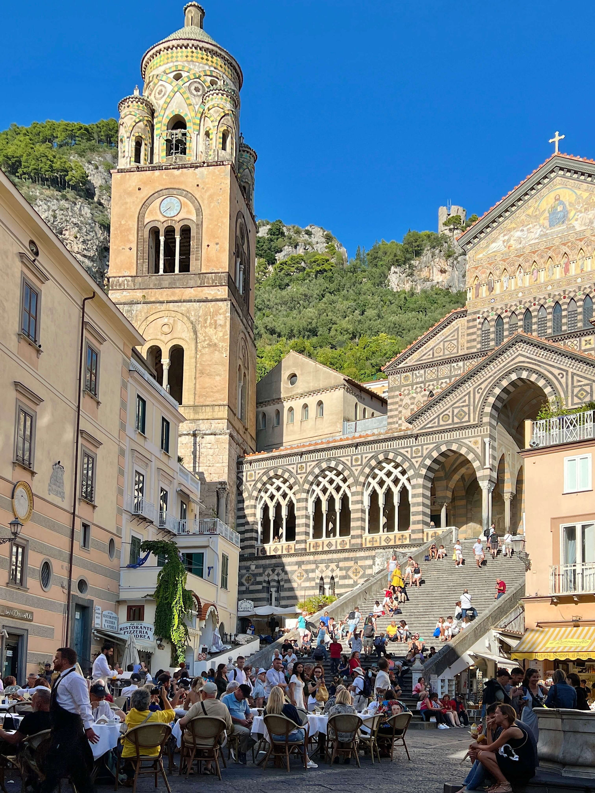 Amalfi square with tourists around 