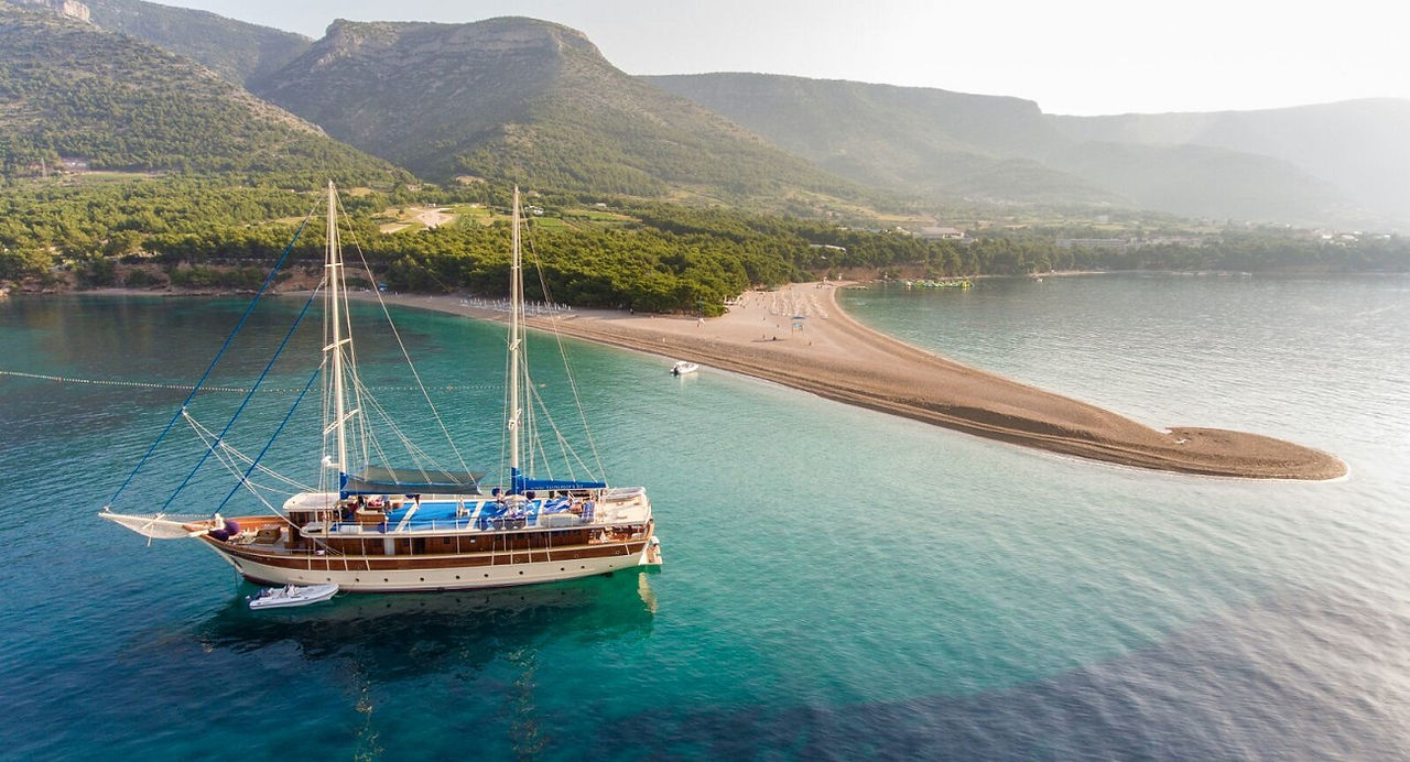Croatian yacht for big groups on anchor near the beach in Croatia