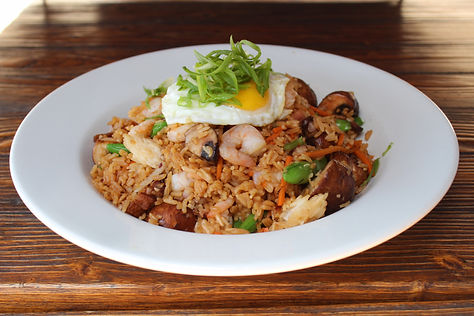 Shrimp & Bacon Fried Rice. Wok fried with carrots, snap peas, mushrooms, garlic, and shallots. Topped with an over easy egg.