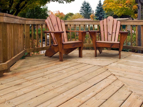wooden chair placed in a wooden back yard