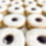Linzer tart cookies filled with raspberry jam