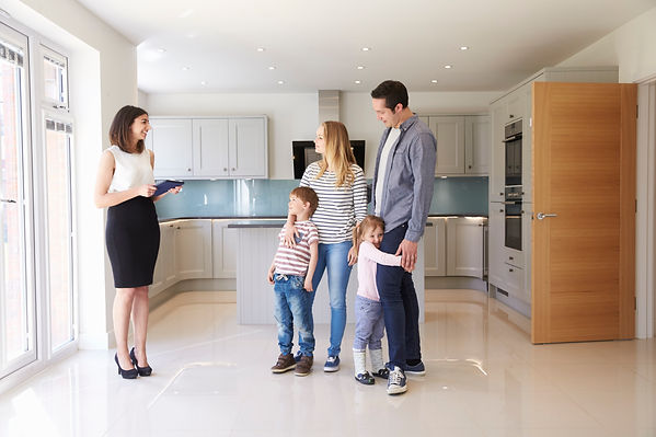 realtor-showing-young-family-around-property-for-s-PUTL8G4.jpg