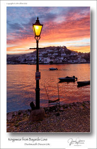 Sunrise over Kingswear from Bayards Cove across the river Dart in Dartmouth Devon UK
