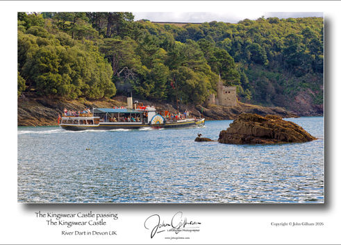 Seen from Dartmouth Castle The Kingswear Castle steam ferry passing The Kingswear Castle on the River Dart in Devon UK