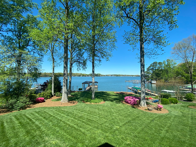 Lake Front Landscape Design Project With Green Striped Lawns After-Results in Lake Norman, NC