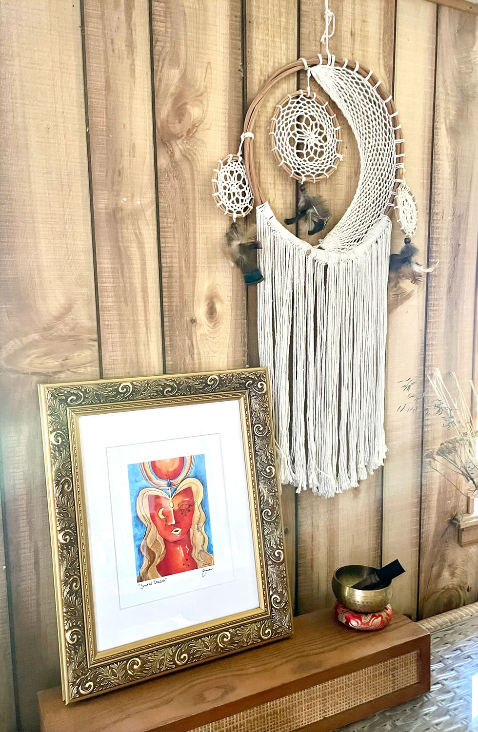 Thumbnail: Sacral Chakra art print in a bronze frame. She is orange and red with golden hair. She has a moon for an eye and a golden and orange sun above her head. This represents passion. 