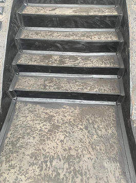 Metal staircase featuring asphalt step renovation.