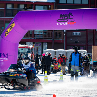 Snowmobile racing action at MESC TripleFest 2026 at Breezy Point Resort in the Brainerd Lakes Area.