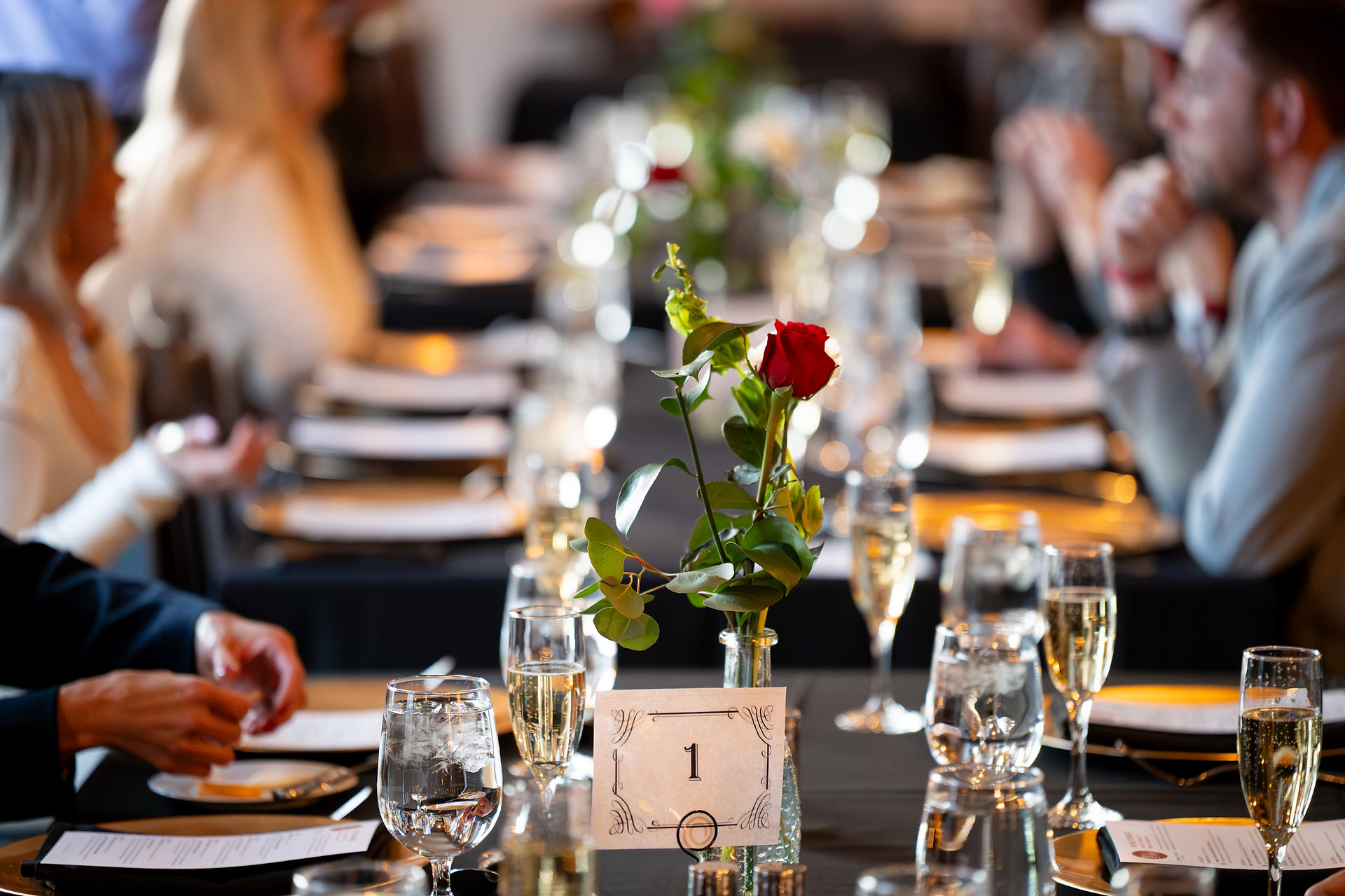 The Heritage Room, set and ready—warm lighting, tables dressed, glassware lined up, and views throug