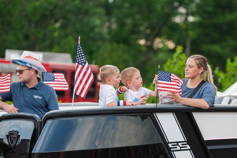 Scenes from the 2025 Nisswa Freedom Days Parade featuring floats, classic cars, local businesses, and community celebration.