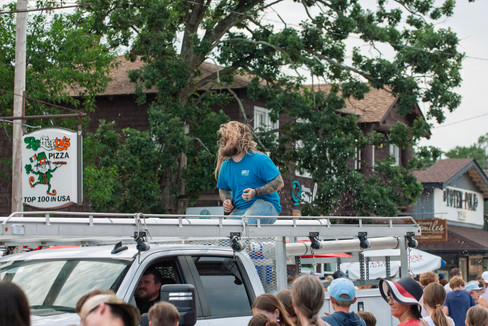 Scenes from the 2025 Nisswa Freedom Days Parade featuring floats, classic cars, local businesses, and community celebration.
