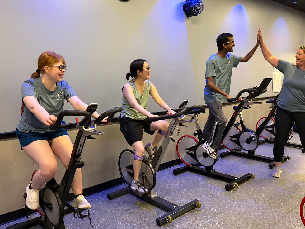People high-fiving at an inclusive gym
