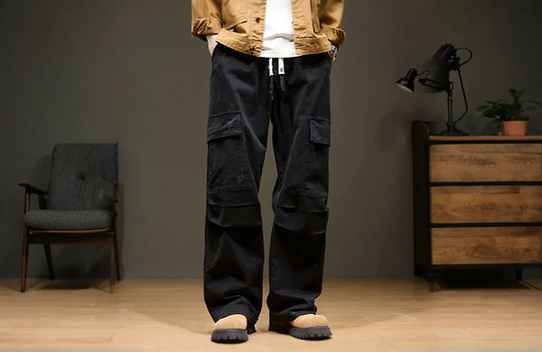 Person wearing black cargo pants