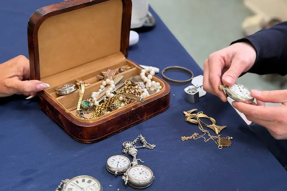 Jewellery and pocket watches on valuation table