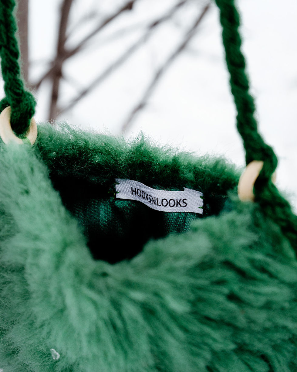 Green fuzzy bag with "HOOKS N' LOOKS" label inside.