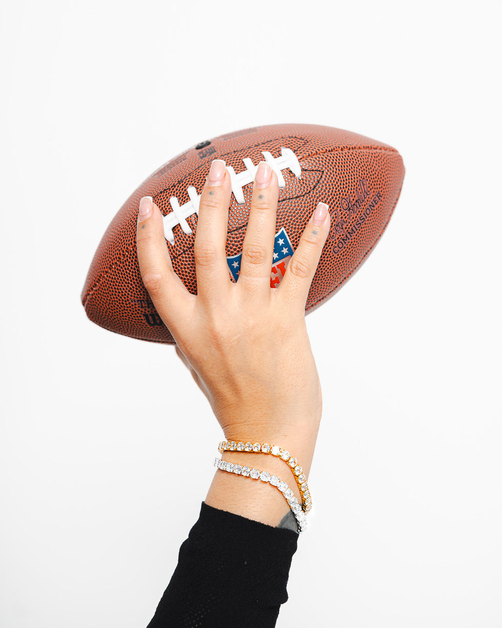 Hand holding football