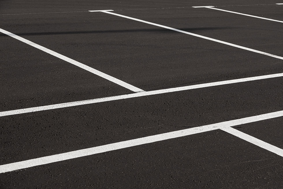 Close-up of freshly marked parking lot with white lines