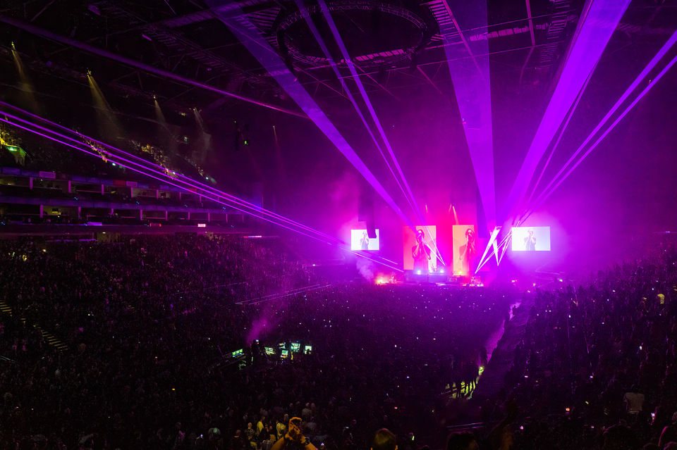 Live show lighting design with layered beams and haze