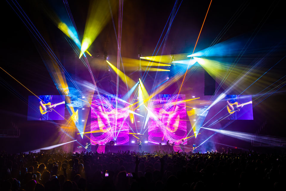 Arena-scale lighting design during a live concert performance