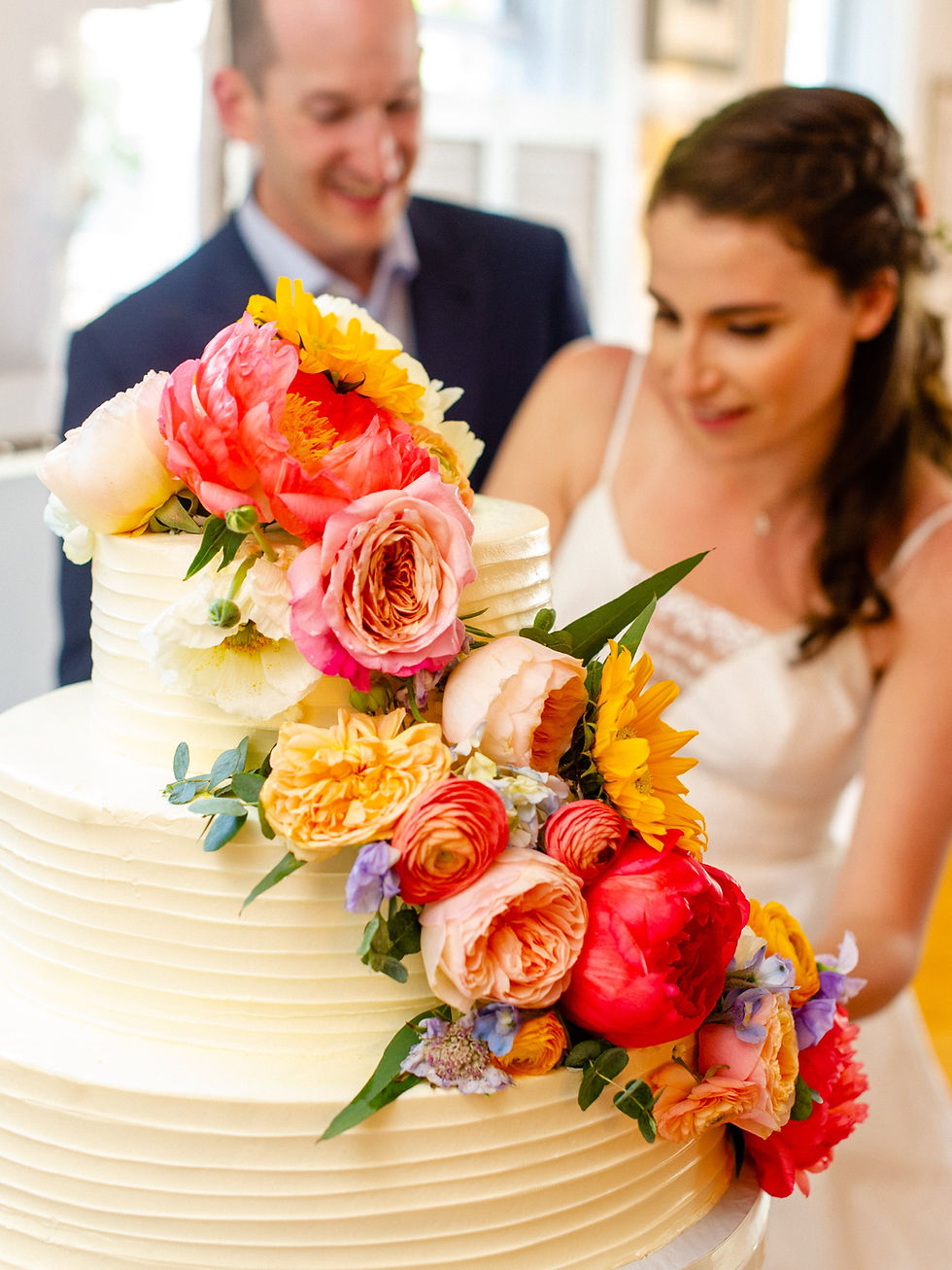 Wedding cake with a cascading flower decor