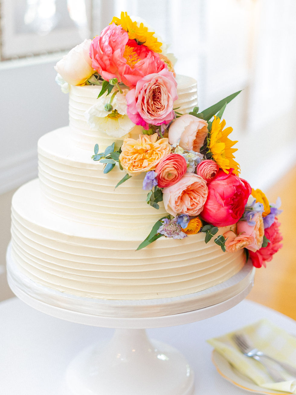 Wedding cake with a cascading flower decor