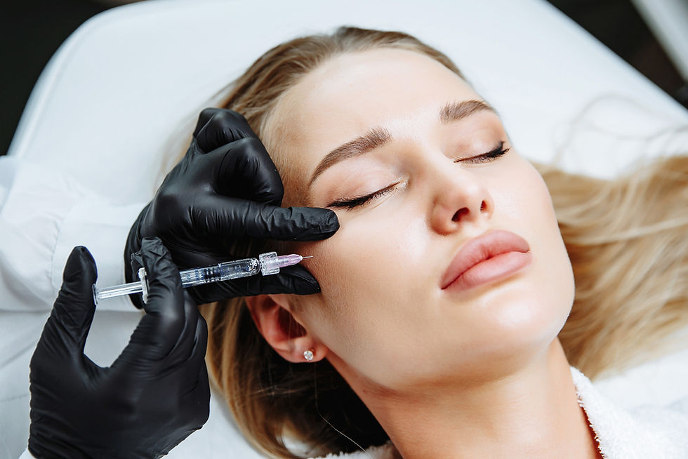 doctor is injecting cheek filler