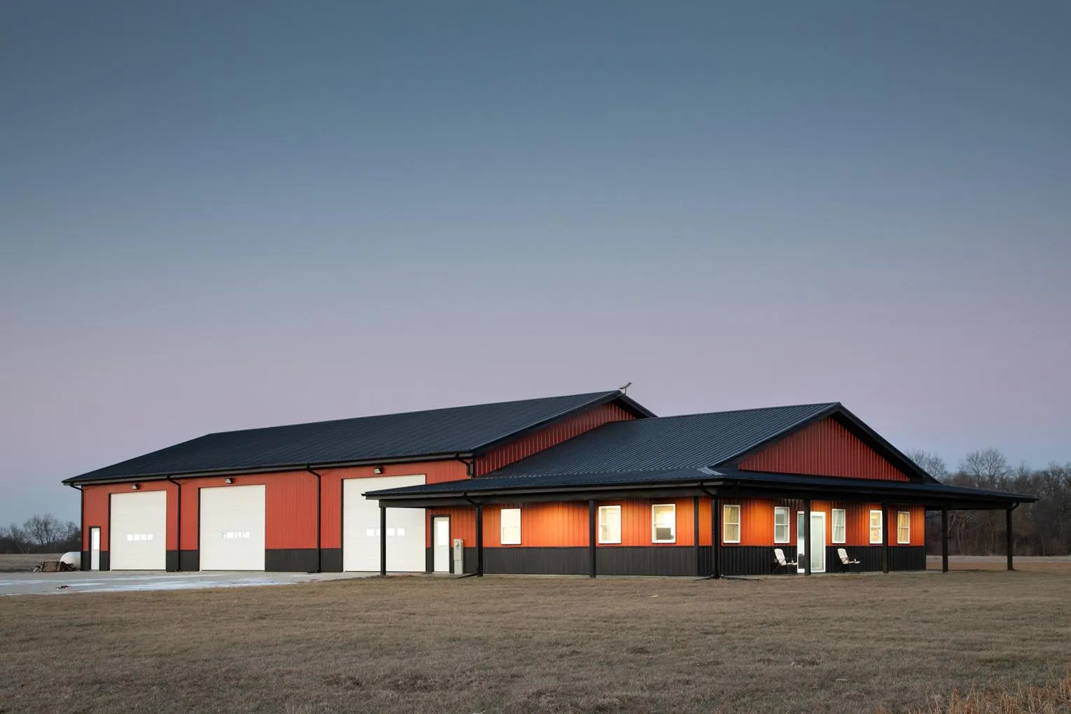 Mercer County IL barndominium with large shop and wraparound porch.