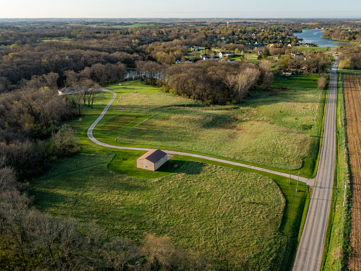 Private driveway entrance to a property that offers great accessibility and possibility to subdivide and develop farther in the future.